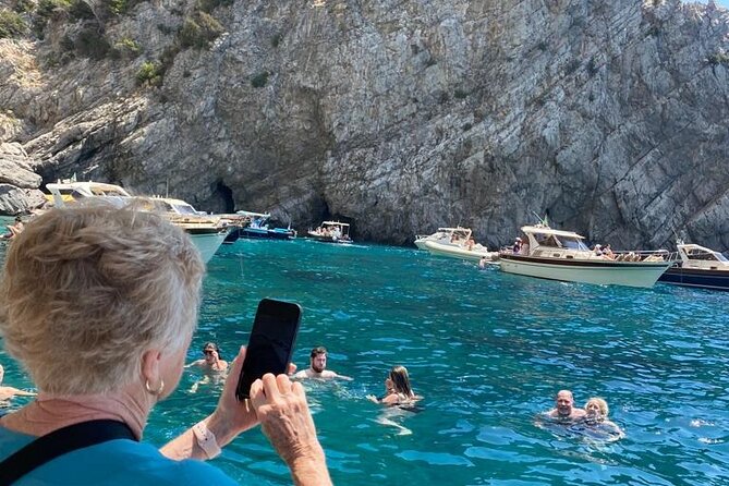 3 Hours Private Boat Tour of Capri with Pasta and Prosecco - Stop 4: Faraglioni and the Lovers Arch photo moment