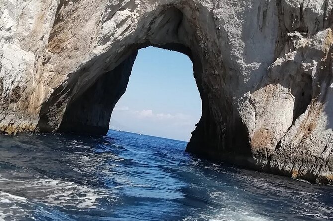 3 Hours Private Capri by Boat for Couples - Faraglioni, natural arch, and Punta Carena lighthouse from sea level
