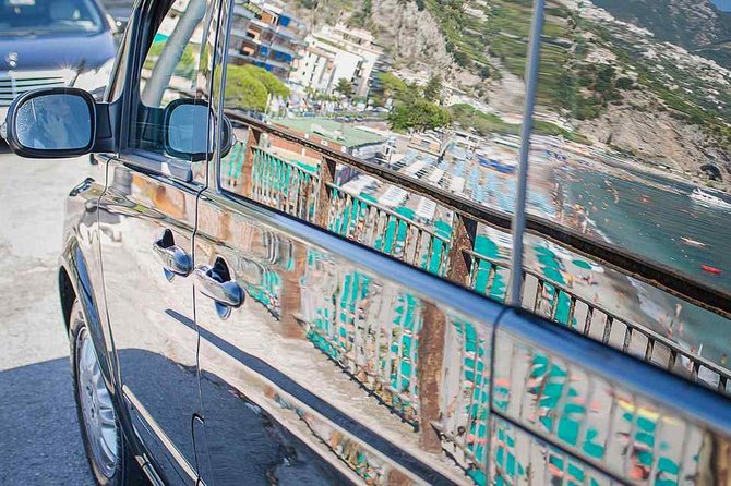 Amalfi coast day tour from Sorrento with an English speaking private driver - Positano for one hour: church, beach, and shop time