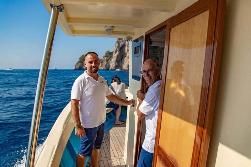 Boat Tour to Capri with Lunch on Board, Swimming and Fun - Yacht Sailing Around Capri: Views, Grottos Pass-By, and Faraglioni