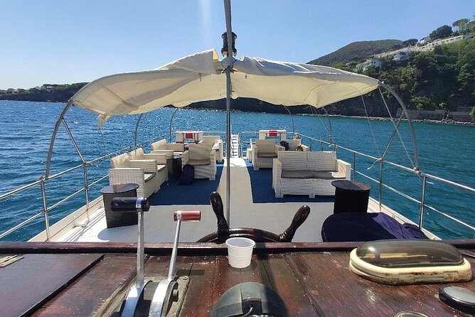 Boat tour with lunch on board to discover Procida - Spiaggia degli Inglesi: a small volcanic beach with WWII history
