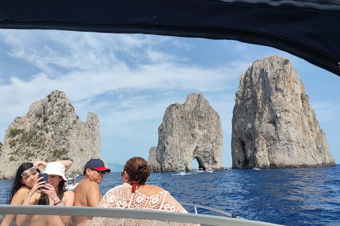 Capri Boat Tour and City Visit from Sorrento - The statue stop and your Capri base at Porto Turistico