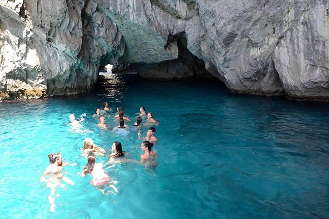 Capri Boat tour from Positano with Light Lunch, Drinks & Swim - The Sorrento coastline glow, then Roman ruins and a cliff waterfall