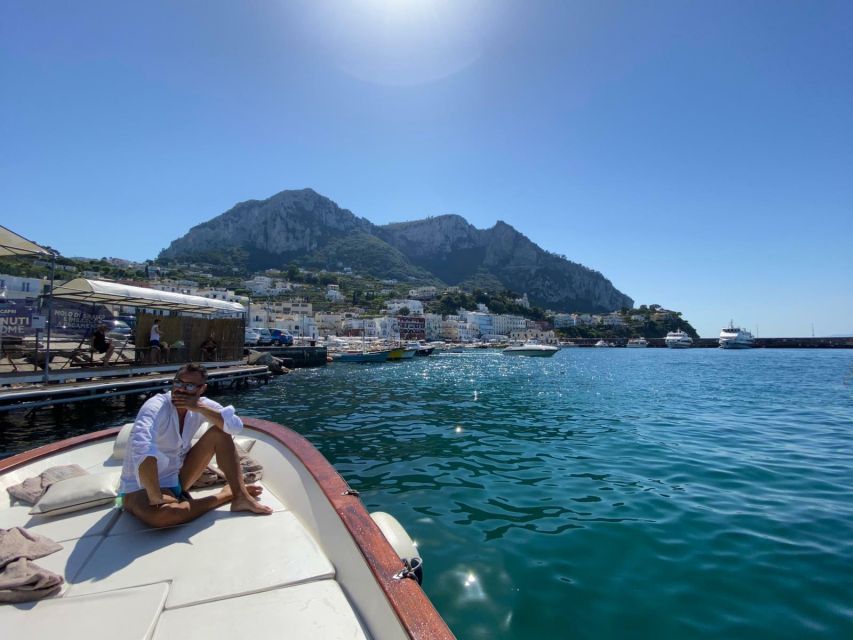 Capri: Island and Grottos Boat Cruise with Snacks and Drinks - Snacks, beverages, and limoncello tasting: the onboard rhythm