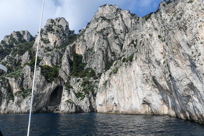 Capri One Day: Visit the Island by Sea and Land with Blue Grotto - The Boat Circuit: Faraglioni, Arch of Love, and Punta Carena