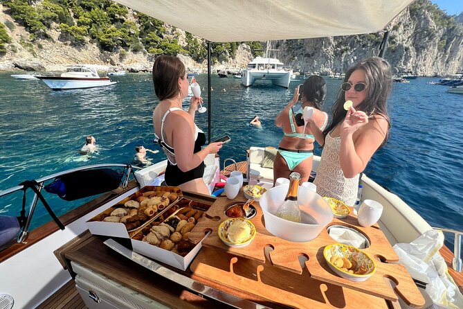 Capri Premium Boat Tour and City Visit Free Bar and Aperitif - Punta Ventroso aperitif break, Albergo dei Marinai, and Faraglioni photos