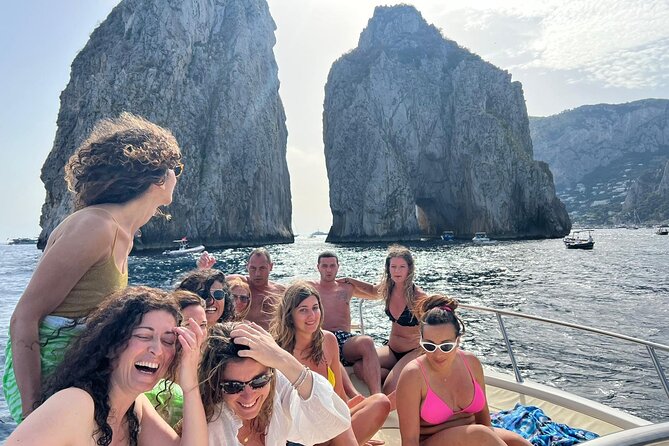 Capri Premium Private Boat Tour + City Visit - Villa Jovis cliff, the Scugnizzo statue, and your final handoff to Capri town