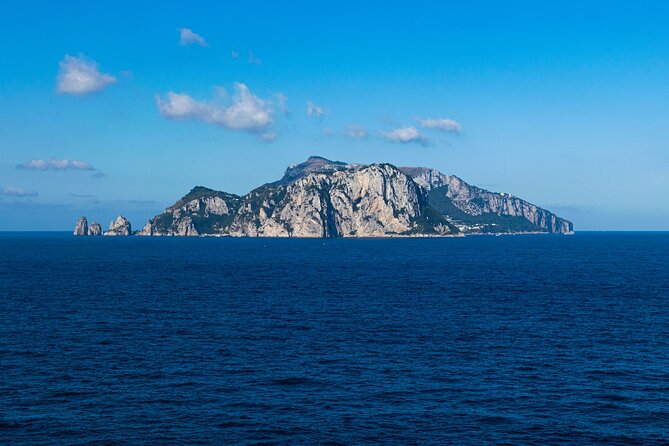 Capri Private Boat Excursion with Faraglioni and Blue Grotto - Positano from the water, plus the Li Galli siren pass