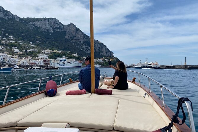 Capri Private Boat Tour from Capri (3 Hours) with Blue Grotto - Drinks, photos, and the vibe on a wooden gozzo boat