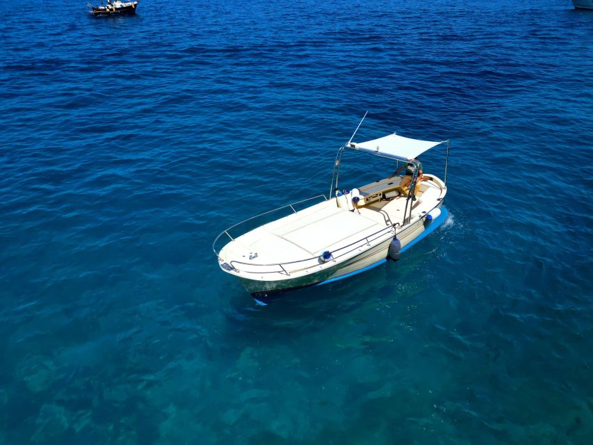 Capri: private boat tour with visit to the caves - Punta Carena lighthouse photo stop and the final return to Piazza Angelo Ferraro