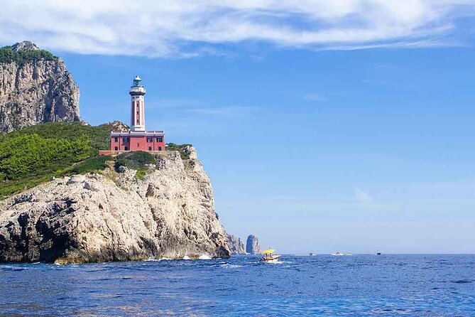 complete tour of the island of Capri by private boat - Stop 1, I Faraglioni: Cliffs, Close Photos, and the Love Arc
