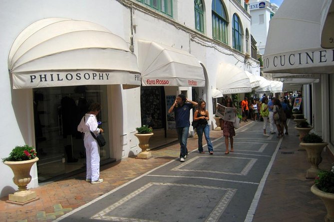 From Amalfi Coast: Capri & Anacapri guided tour by sea & by land - Capri town walking tour: Piazzetta, Via delle Camerelle, Decumanus, Augustus Gardens