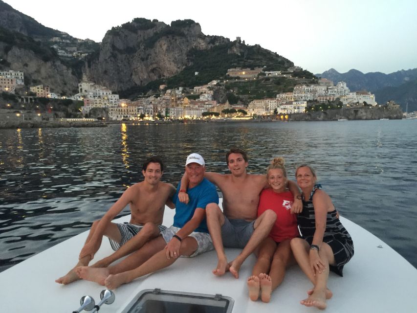 From Amalfi: Private Sunset Cruise along the Amalfi Coast - Leaving the harbor in Amalfi: pastel cliffs in slow motion