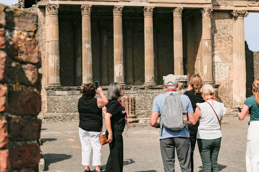From Naples: Pompeii Skip-the-Line Guided Tour - Temple of Jupiter and the Theater District: where religion meets entertainment