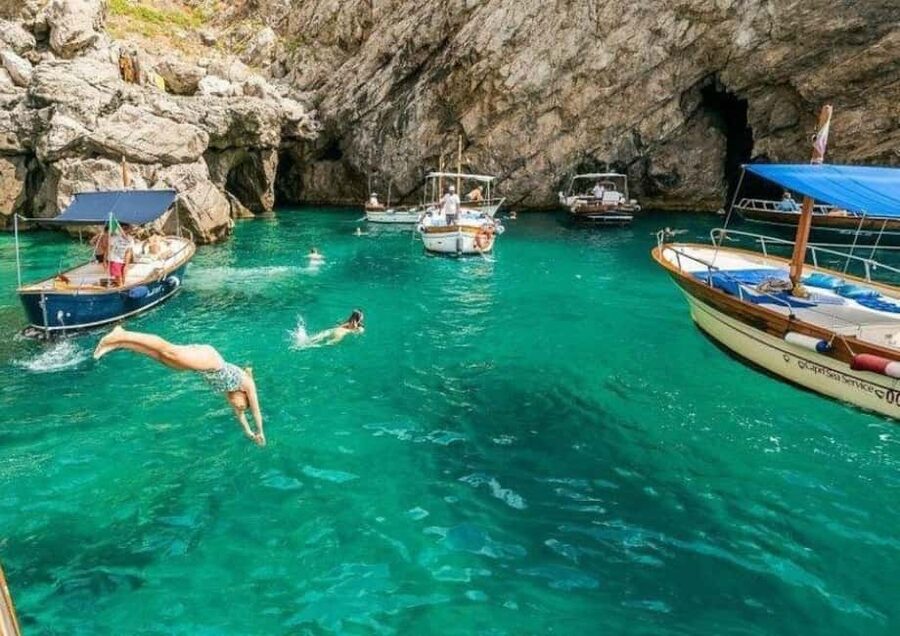 From Praiano: Full Day Private Boat Tour of Capri in Relax - Meeting at La Praia, then stepping into an 8-meter Gozzo