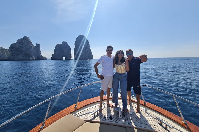 From Sorrento: Capri & Blue Grotto Boat Day Tour Up to 8 People - The sea ride to Capri: coastline views, Marina Grande, and Roman-era scenery