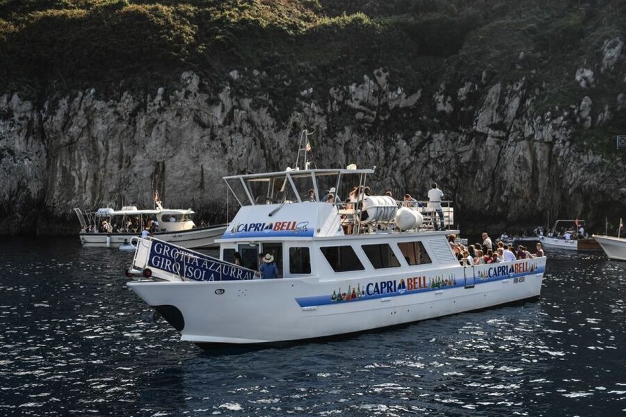 From Sorrento: Day Trip to Capri with Blue Grotto - The guided boat loop around Capri: Faraglioni and grotto viewpoints from the sea