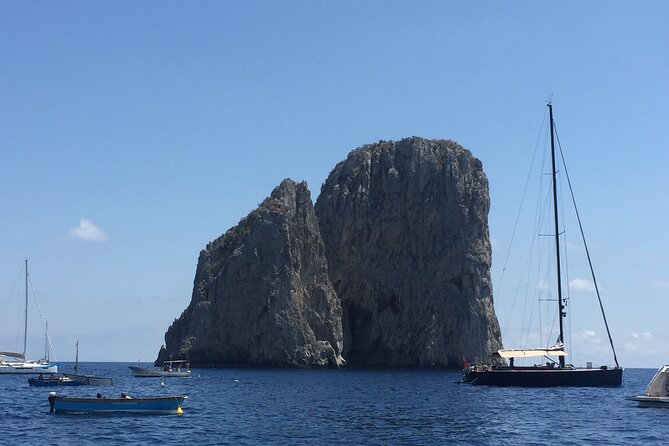 Full Day Private Boat Tour of Capri - Capri’s Cliff Classics: Natural Arch, Faraglioni, Punta Carena, and White Grotto
