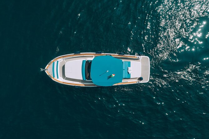 Ischia and Procida Private Yacht Tour from Sorrento - Onboard experience: skipper skills, snacks, drinks, and that music vibe