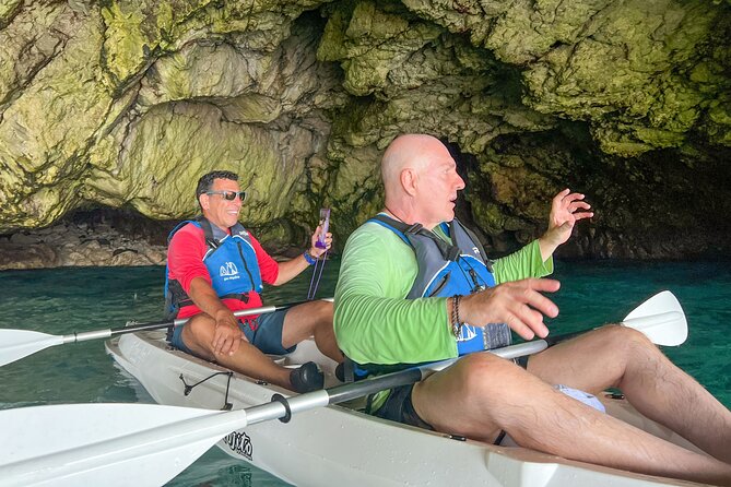 Kayak tour in Capri between caves and beaches. Photos included. - Optional Swim Stop: Refreshing, but Go in Ready