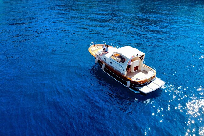 Luxury private boat tour to Capri and Blue Grotto on Gozzo 32 ft - Blue Grotto by Rowboat: The Main Event and the €100 Fee Detail
