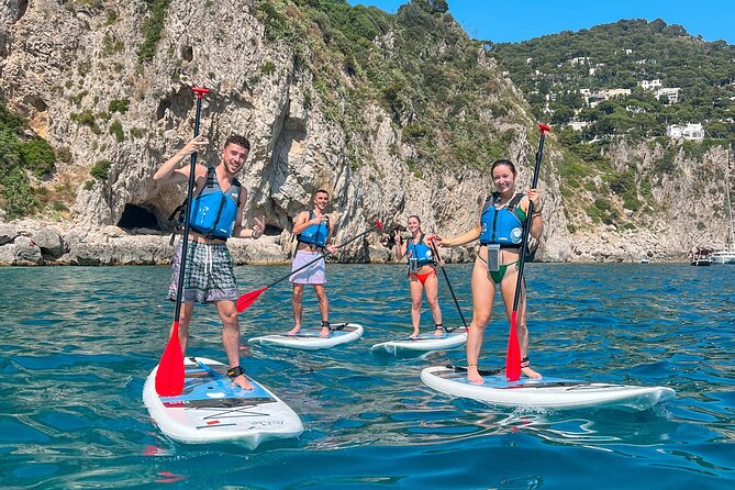Paddleboard in Capri between caves and beaches. Photos included! - Faraglioni photos: why your background matters