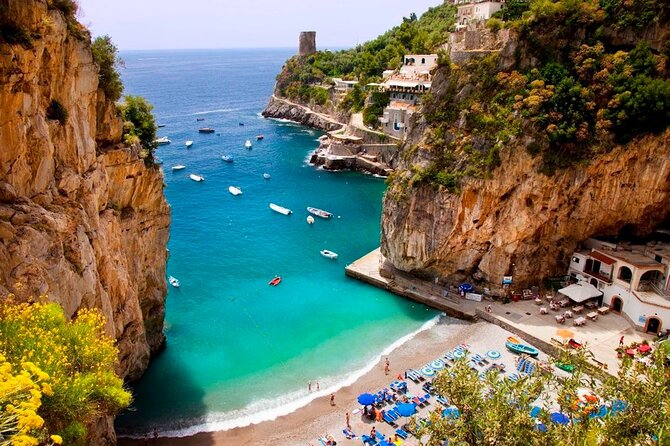 Positano & Amalfi Boat Tour from Sorrento: Swim & Light Lunch - Positano: iconic cliff views with only about an hour