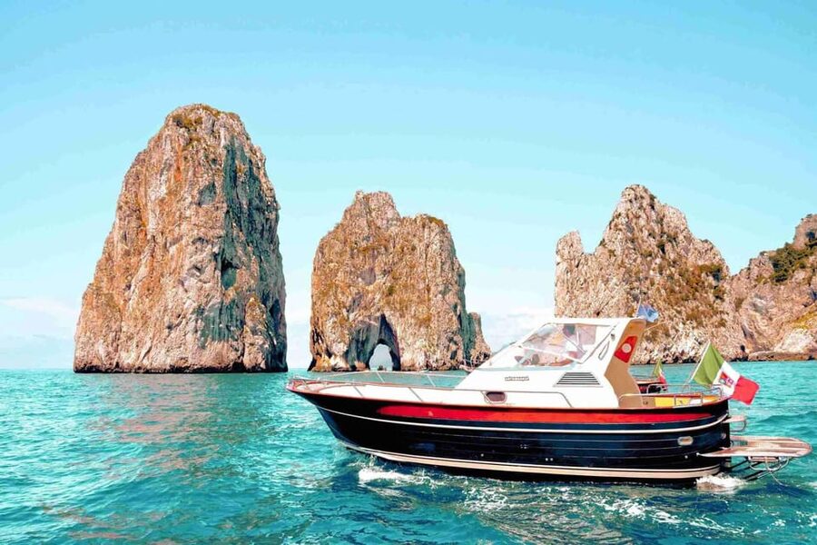 Positano: Capri and Blue Grotto Shared Boat Tour with Drinks - From Positano to the Port: your day starts with the Amalfi views