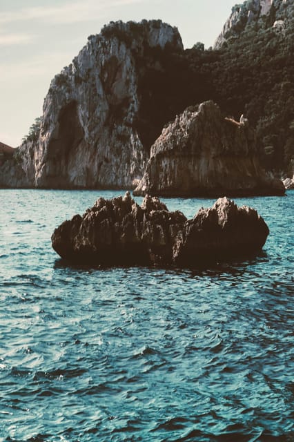 Positano: Capri and Blue Grotto Shared Boat Tour with Drinks - Swim stop and snorkeling masks: the sea time is one of the best parts