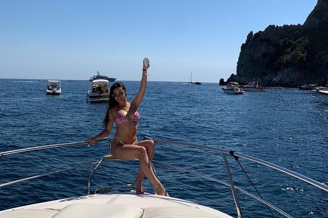 Private Boat Tour Costiera Amalfitana e Capri Esposito 28 Luxury - Cala di Puolo (and the Riviera di San Montano stop): fishermen, cliffs, and Capri on the horizon