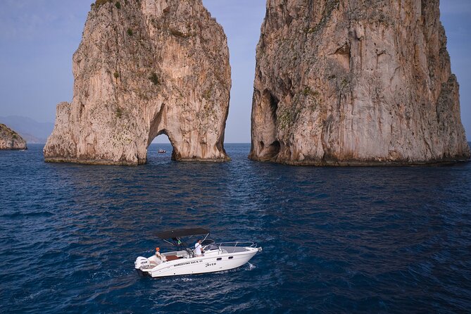 Private Boat Tour with Saver 7.50 WA - Punta Carena Lighthouse: a red-and-white coastline landmark from the sea