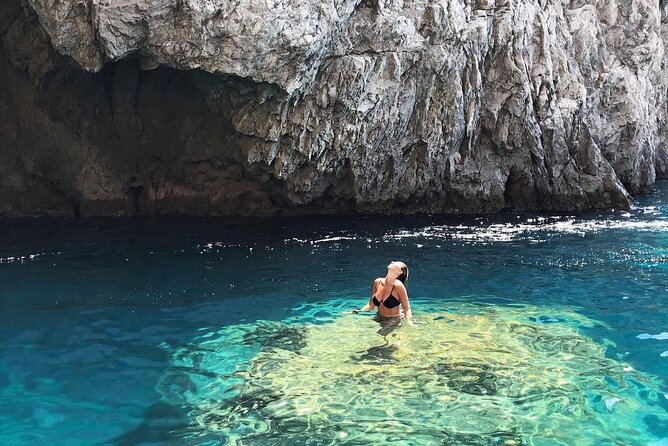 Private boat trip to Capri - I Faraglioni: sailing under the arch for the iconic angle