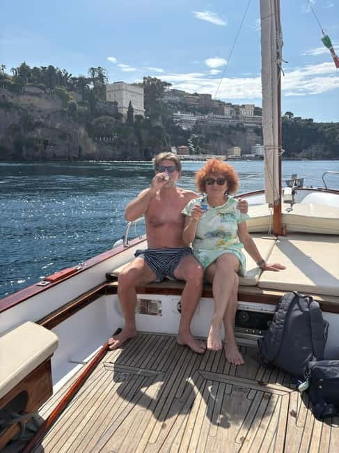 Sorrento: Boat Coastal Cruise with Swim and Limoncello - Marina di Puolo and the Sorrento coastline feel up close