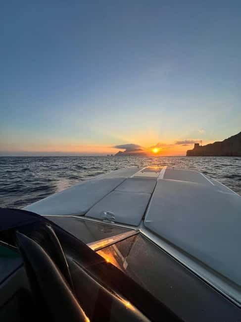 Sorrento: Sunset Coastal Boat Tour with Aperitif - Punta Lagno: where the water turns into your best photo and swim stop