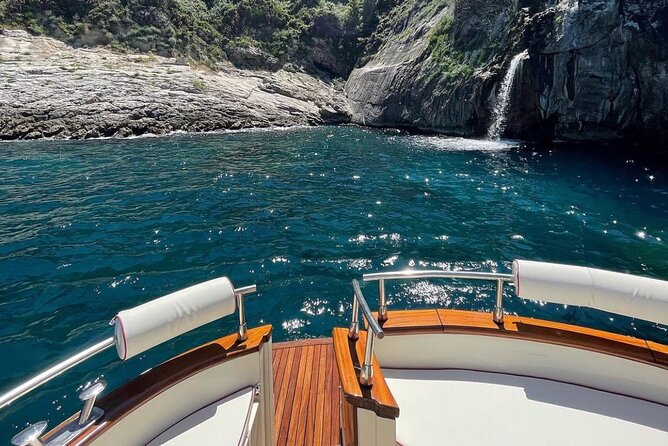 Sunset boat experience in Sorrento coast - Stop 3: Massa Lubrense coastline and the natural waterfall shower from the boat